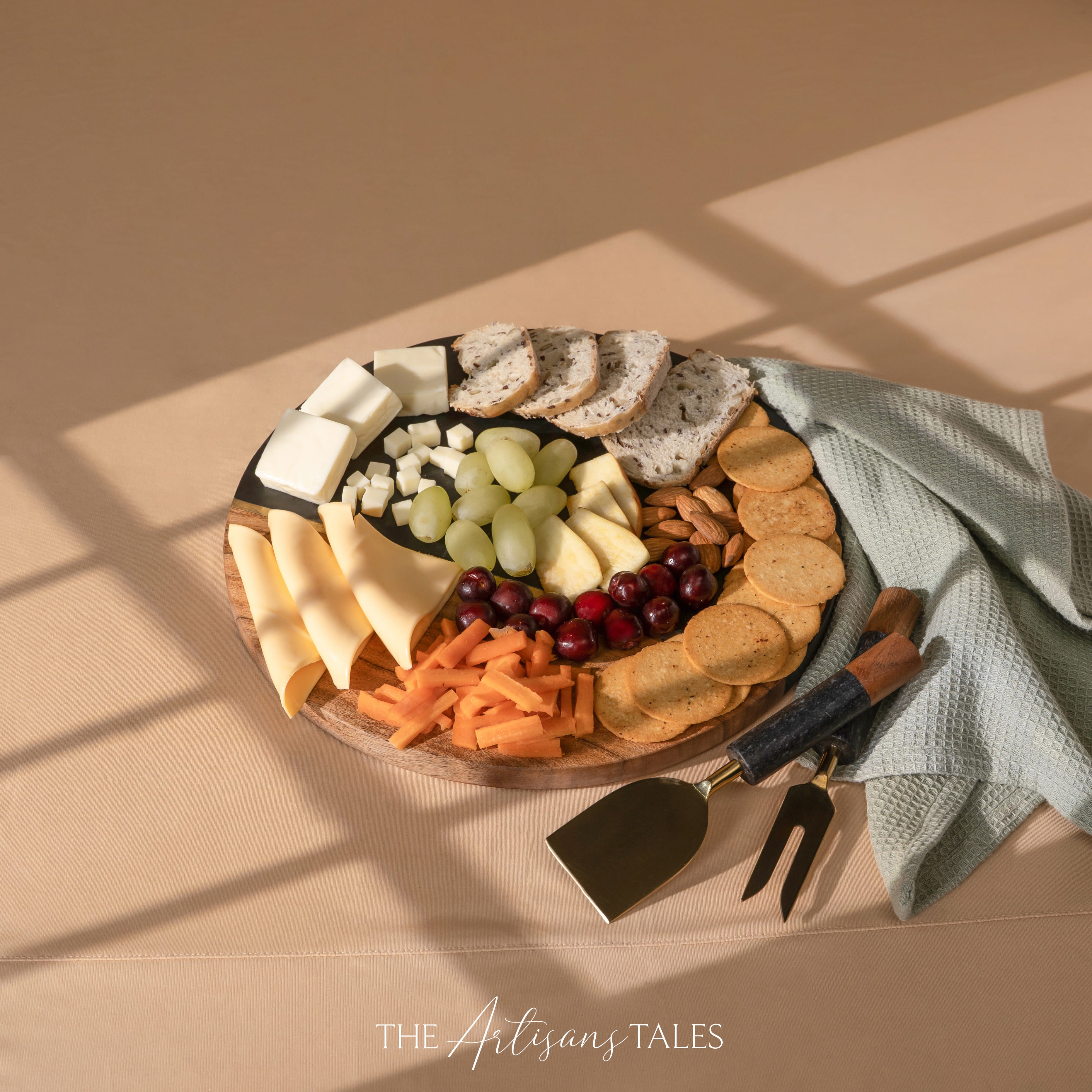 Assorted cheese, crackers, and fruits on a wooden board