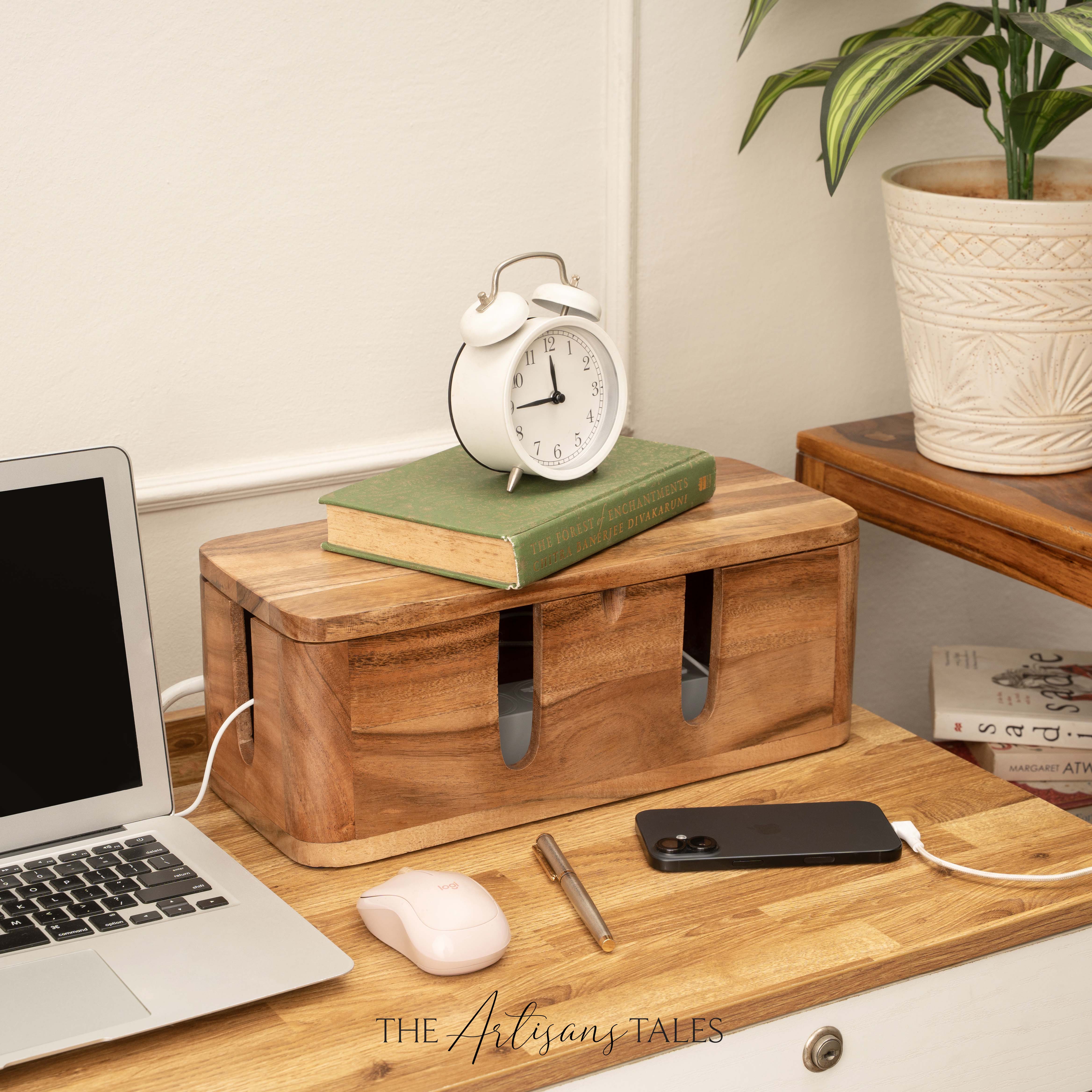 Wooden desk organizer with laptop, phone, mouse, and clock on a wooden surface.