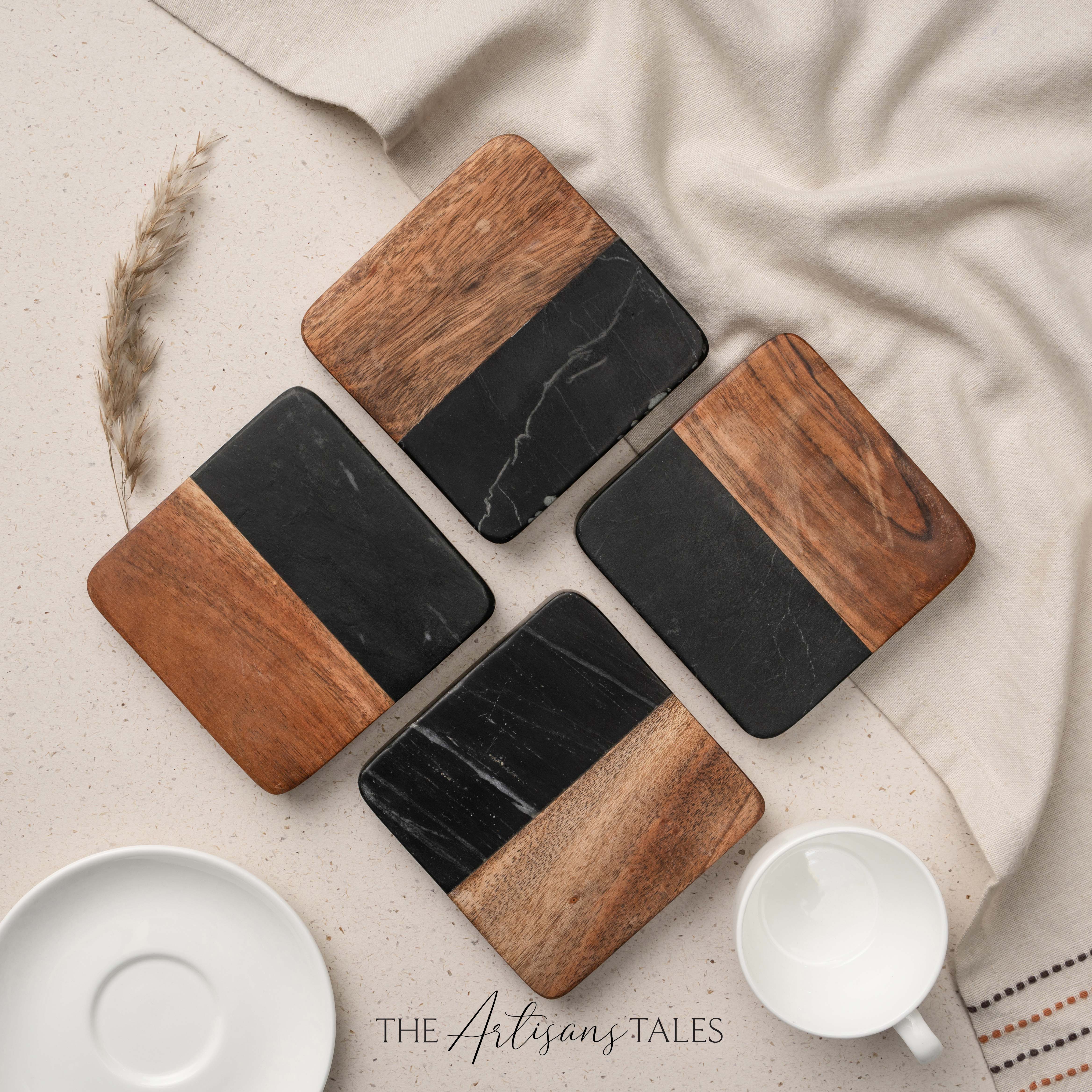 Set of wooden and black marble coasters