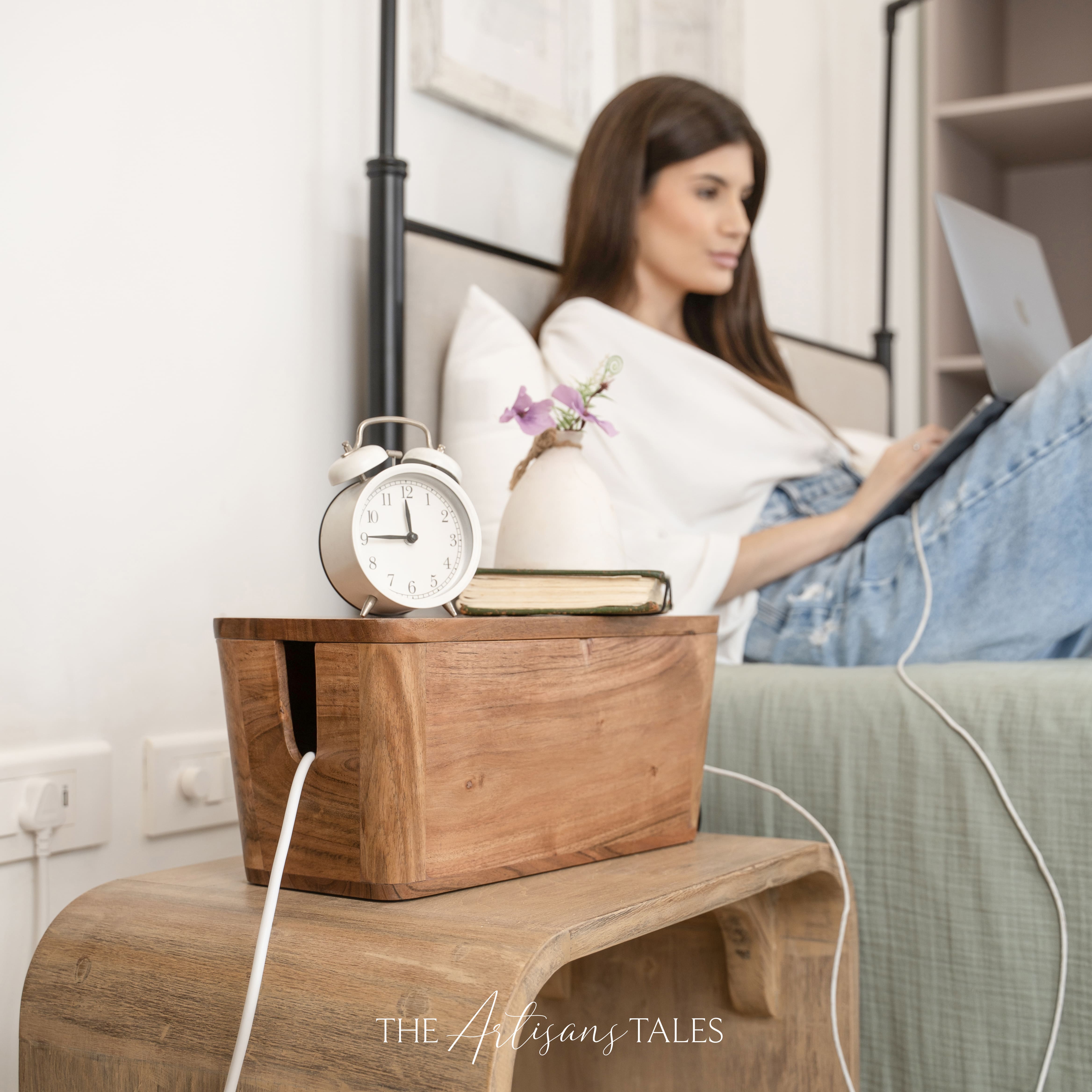 Luxury handcrafted wooden bedside box on nightstand with books and alarm clock