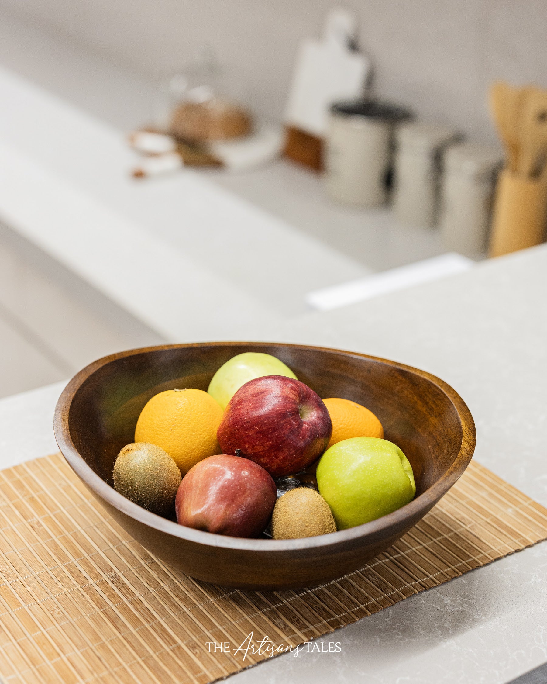 Wooden bowl filled with fresh fruits
