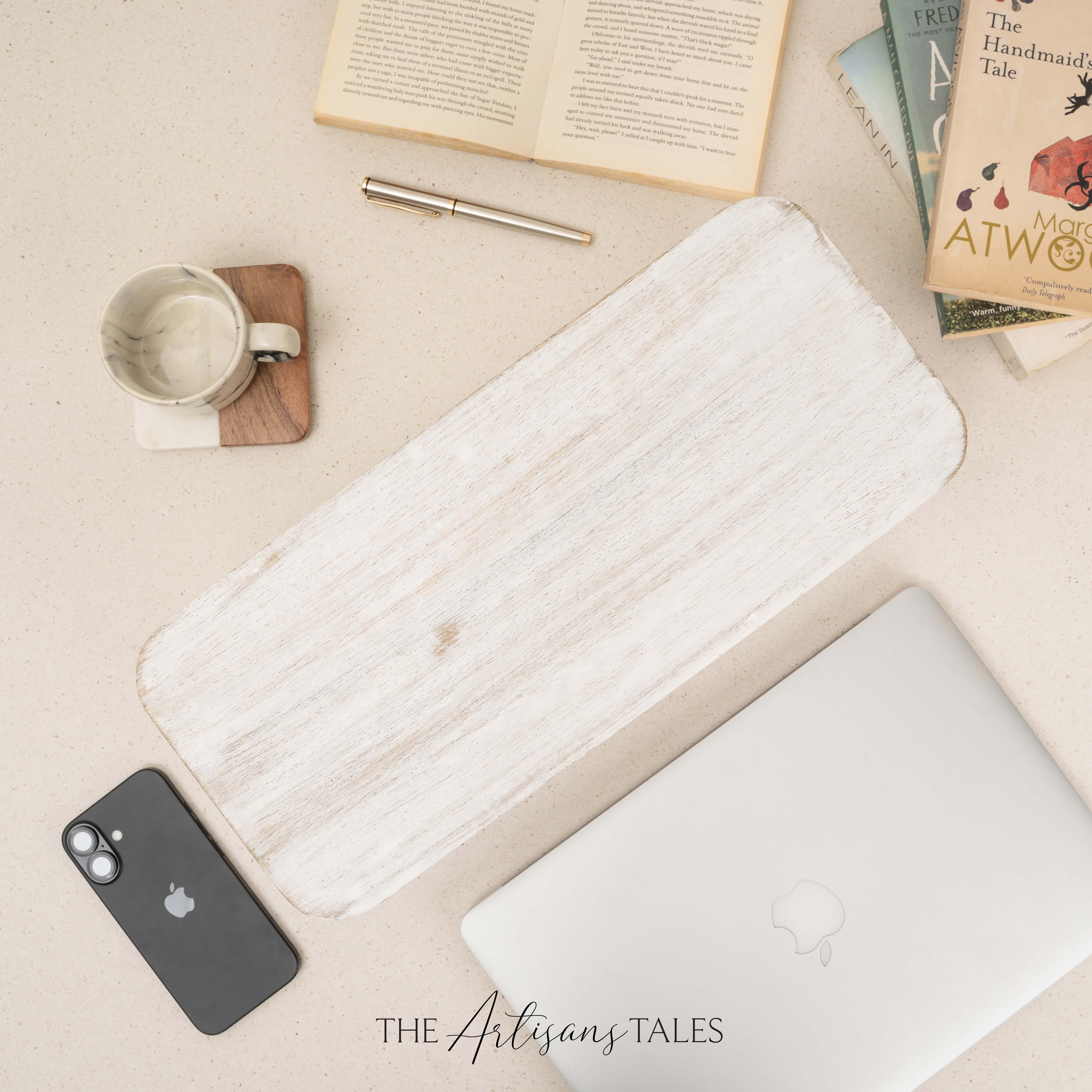 White wooden desk organizer on beige desk with laptop and books