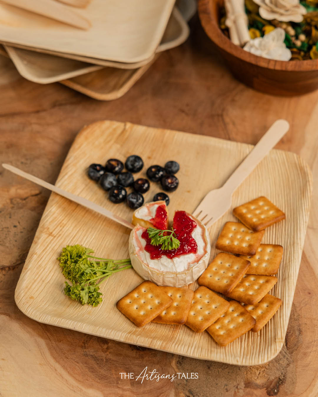 eco dining setup with palm plates and wooden cutlery