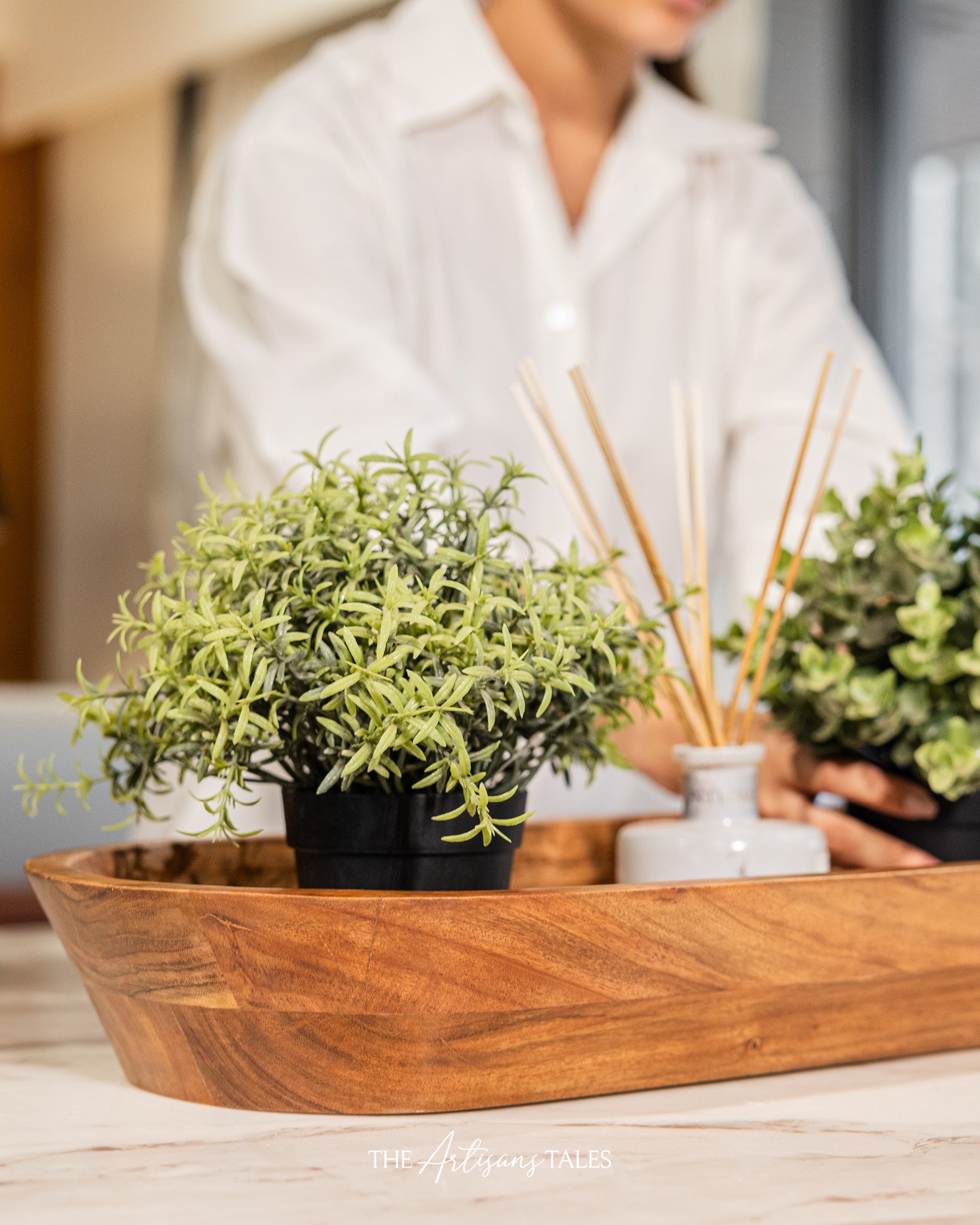 Wooden tray with plants and diffuser