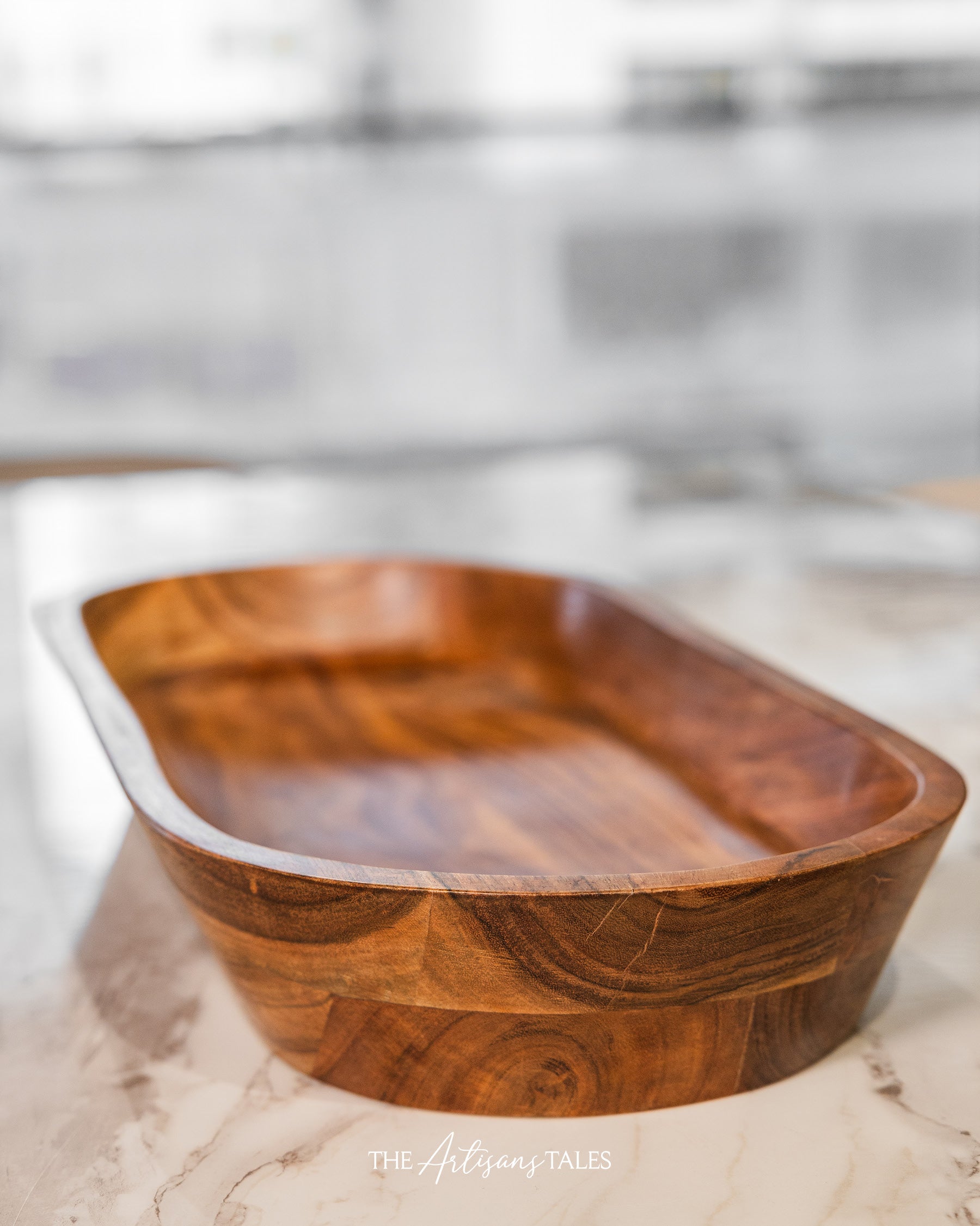 Empty dark wooden bowl on table